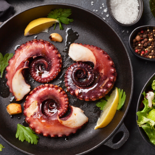 GRILLED OCTOPUS WITH HUMMUS AND CARAMELIZED ONIONS