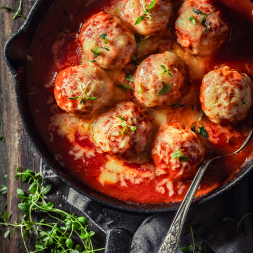 MEATBALLS IN TOMATO SAUCE TOPPED CHEESE